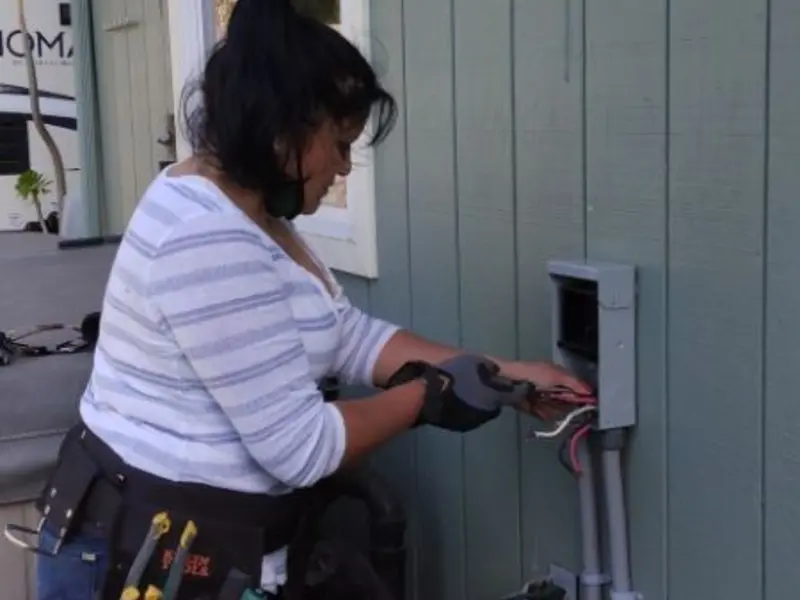 Licensed electrician wiring an exterior subpanel in Brigantine
